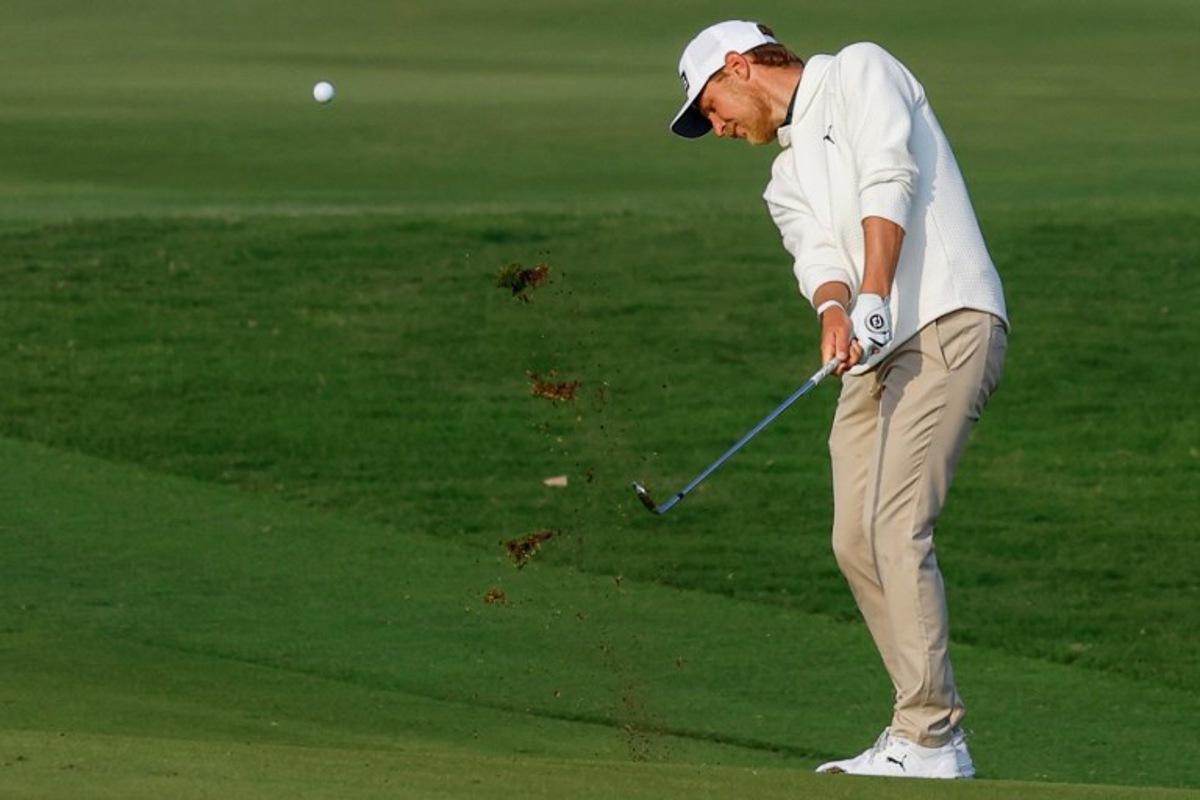Kristoffer Reitan of Norway plays a shot during the first day of the European Tour of Qatar Masters golf tournament in Doha on February 6, 2025. KARIM JAAFAR / AFP