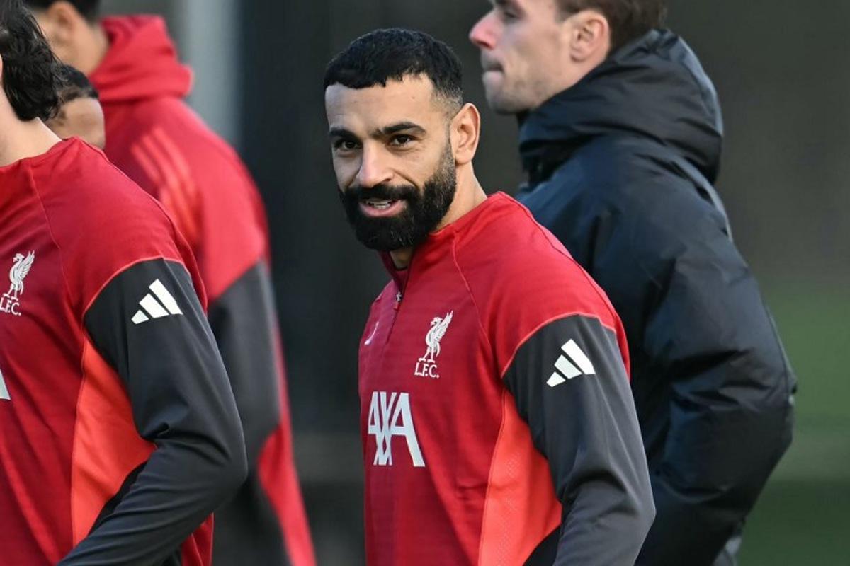Liverpool's Egyptian striker #11 Mohamed Salah attends a team training session at their training ground in Kirkby, Liverpool, north-west England on December 8, 2025, on the eve of their UEFA Champions League, league phase football match against Inter Milan in Milan. Mohamed Salah plunged his future at Liverpool into serious doubt after claiming he had been made the fall guy for the Premier League champions' disastrous form this season. Paul ELLIS / AFP