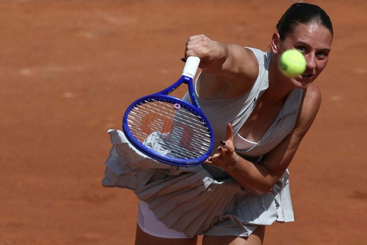 Ukraine's Marta Kostyuk serves to Oksana Selekhmeteva during their women's singles match on day 1 of the French Open tennis tournament on Court Simonne-Mathieu at the Roland-Garros Complex in Paris on May 24, 2026. ALAIN JOCARD / AFP