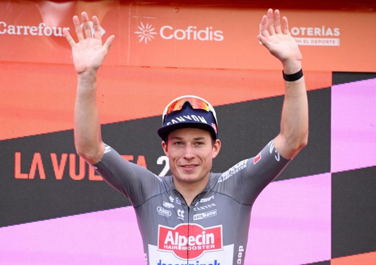Team Alpecin's Belgian rider Jasper Philipsen celebrates on the podium after winning the eighth stage of the Vuelta a Espana, a 158 km race between Monzon Templario and Zaragoza, on August 30, 2025. Josep LAGO / AFP