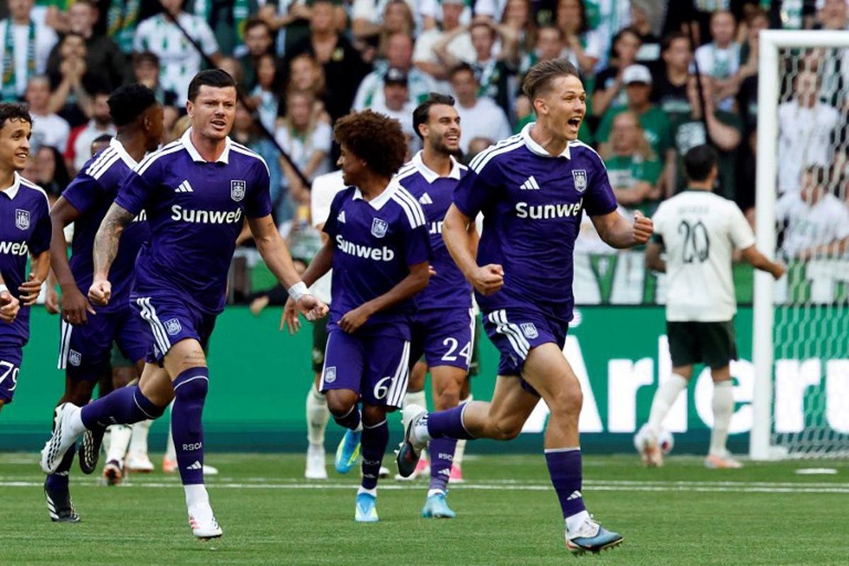 Anderlecht's Danylo Sikan (R) celebrates after scoring the 1-0 goal with teammates during the UEFA Europa League second qualifying round, 1st leg football match between Hammarby IF and RSC Anderlecht at Stockholm Arena in Stockholm, Sweden, on July 23, 2026. Stefan JERREVANG / TT News Agency / AFP