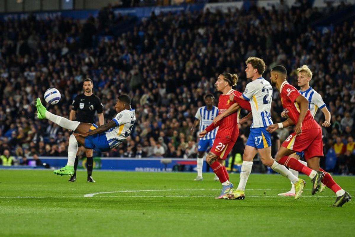 Brighton's Ecuadorian defender #30 Pervis Estupinan shoots the ball during the English Premier League football match between Brighton and Hove Albion and Liverpool at the American Express Community Stadium in Brighton, southern England on May 19, 2025. Glyn KIRK / AFP