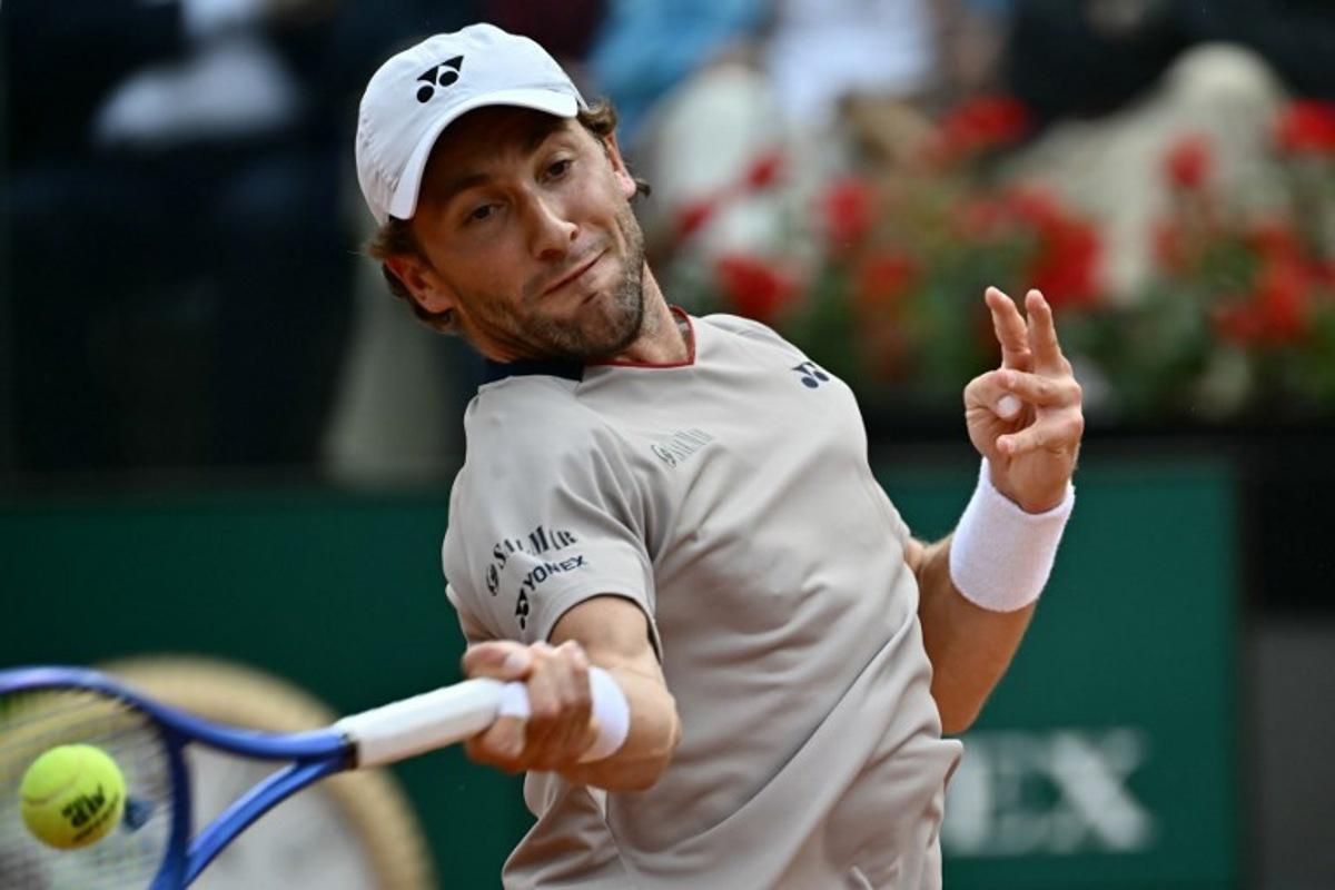 Norway's Casper Ruud hits a return to Italy's Luciano Darderi during their semi-final of the ATP Rome Open tennis tournament at Foro Italico in Rome on May 15, 2026. Filippo MONTEFORTE / AFP