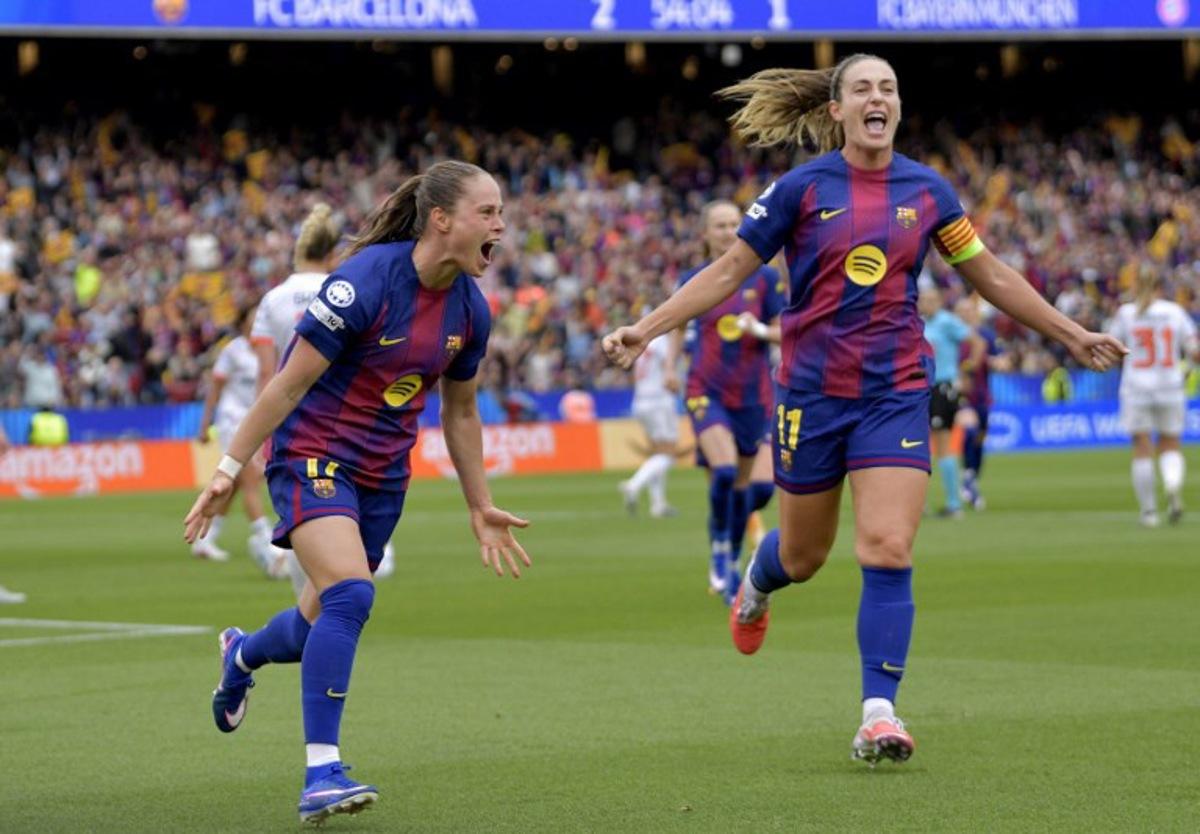 Barcelona's Polish forward #17 Ewa Pajor celebrates with Barcelona's Spanish midfielder #11 Alexia Putellas (R) scoring her team's third goal during the UEFA Women's Champions League semi-final second leg football match between FC Barcelona and Bayern Munich at Camp Nou Stadium in Barcelona on May 3, 2026. MANAURE QUINTERO / AFP