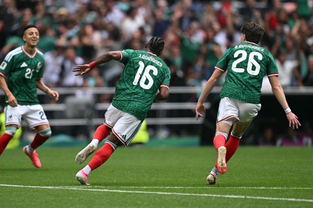 Mexico's forward #16 Julian Quinones celebrates scoring his team's first goal next to teammate midfielder #26 Brian Gutierrez during the 2026 World Cup Group A football match between Mexico and South Africa at the Mexico City Stadium in Mexico City on June 11, 2026. Yuri CORTEZ / AFP