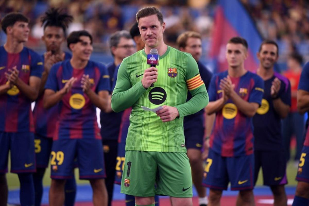Barcelona's German goalkeeper Marc-Andre Ter Stegen delivers a speech before the 60th Joan Gamper Trophy football match between FC Barcelona and Como 1907 at Johan Cruyff Stadium in Barcelona on August 10, 2025. Josep LAGO / AFP