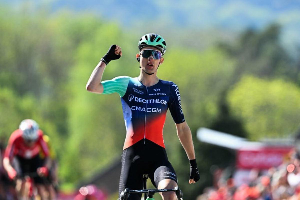Decathlon CMA CGM Team's French Paul Seixas celebrates as he crosses the finish line to win 'La Fleche Wallonne' one day cycling race, 200 km from Herstal to Huy, on April 22, 2026. JOHN THYS / AFP