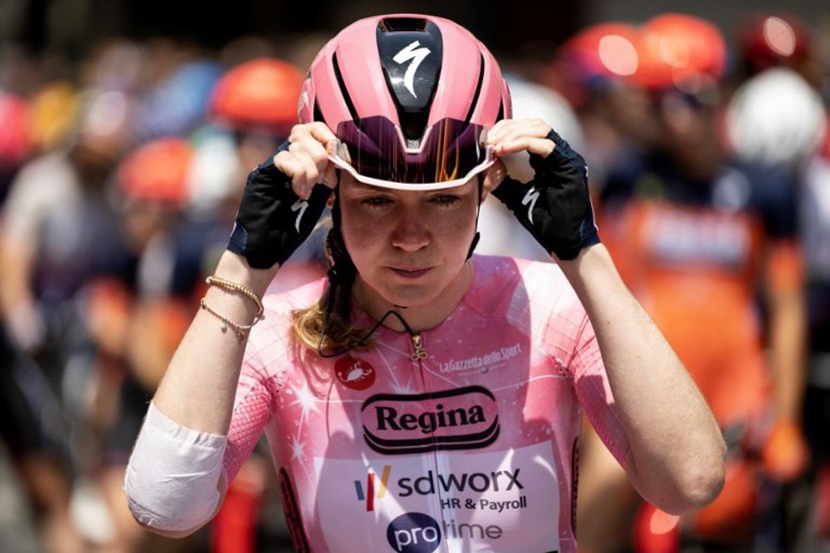 SD Worx-Protime's Dutch cyclist Anna van der Breggen, wearing the overall leader's pink jersey (Maglia Rosa), waits at the start of the 9th stage of the Giro d'Italia Women 2026 between Saluzzo and Saluzzo in Saluzzo, southeastern France, on June 7, 2026. MARCO BERTORELLO / AFP