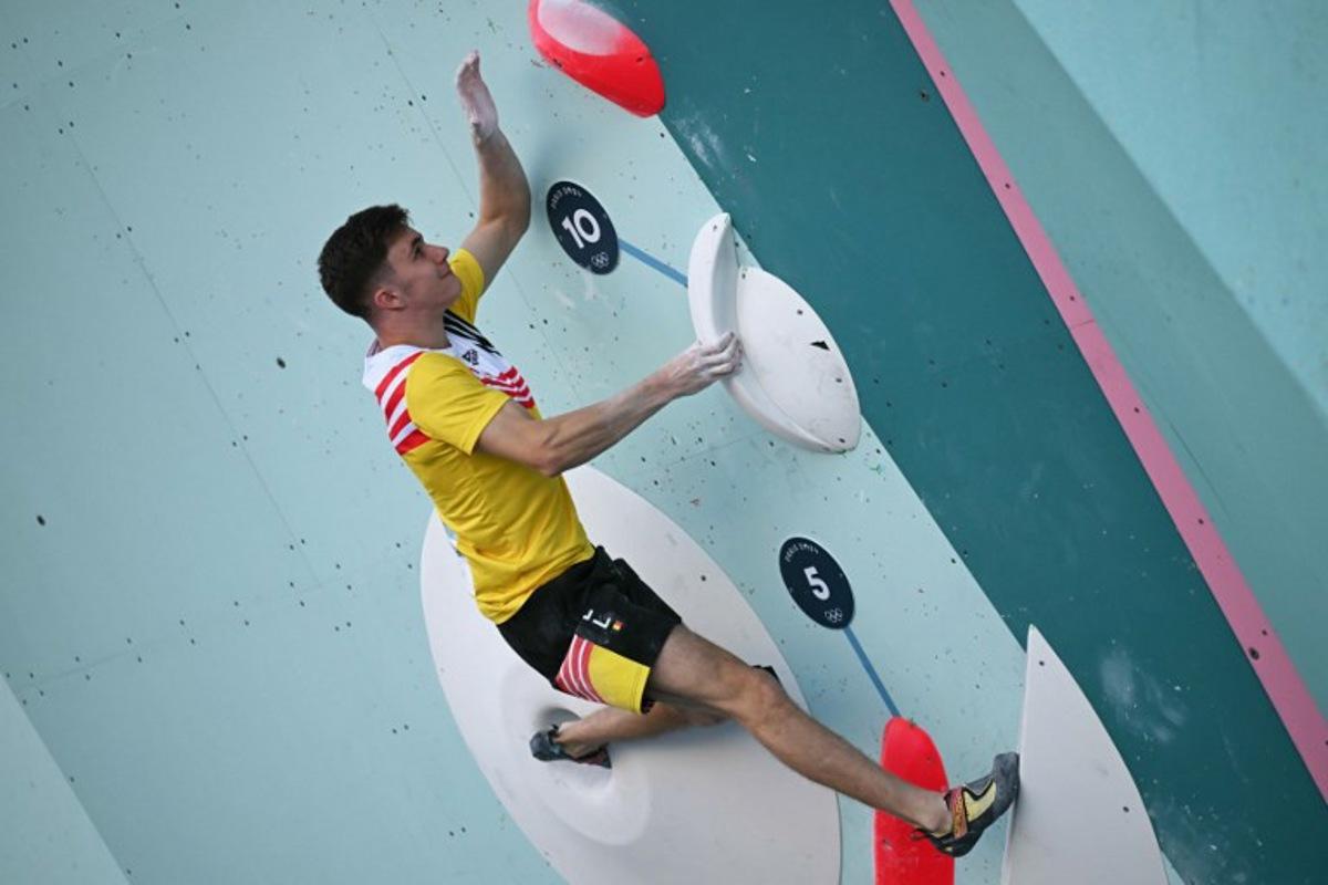 Belgium's Hannes Van Duysen competes in the men's sport climbing boulder semi final during the Paris 2024 Olympic Games at Le Bourget Sport Climbing Venue in Le Bourget on August 5, 2024. Fabrice COFFRINI / AFP