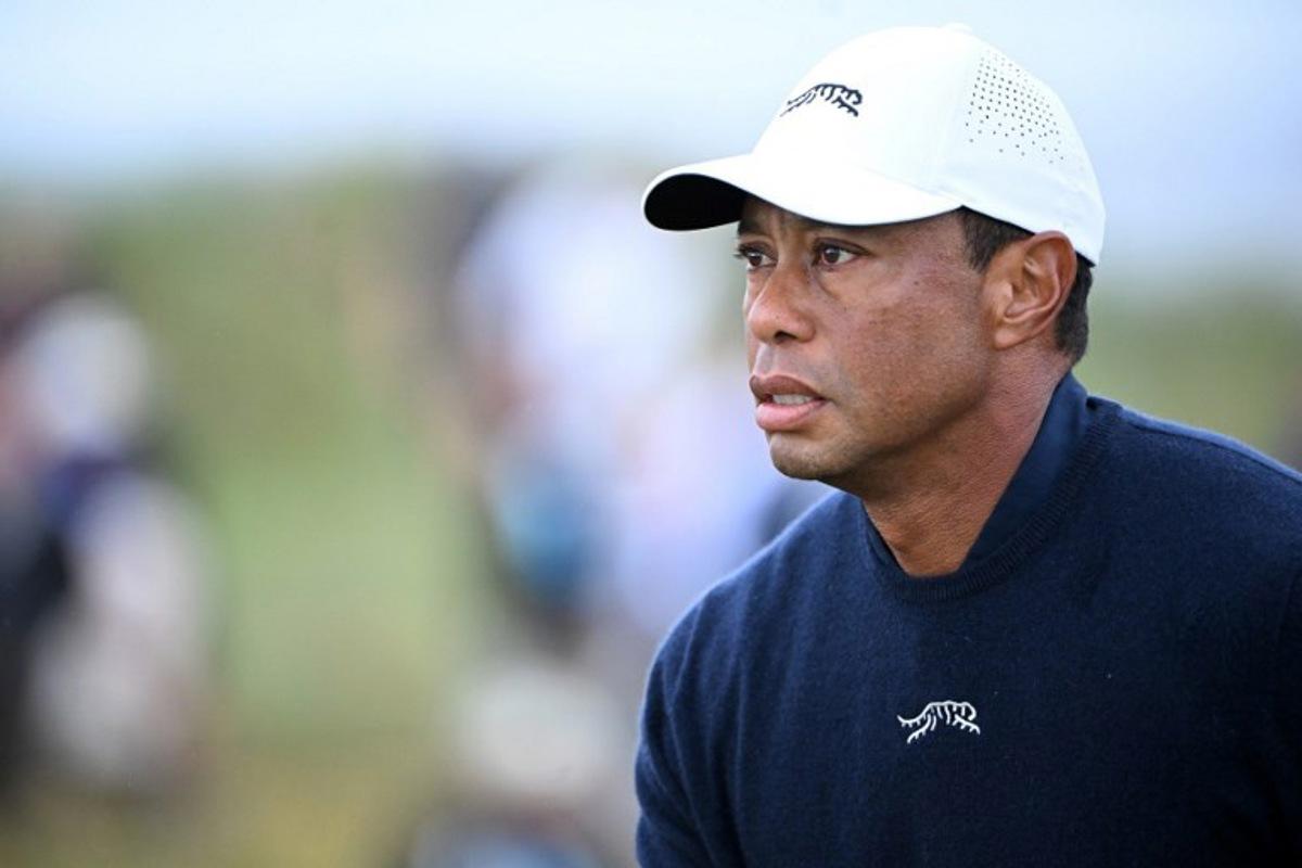 (FILES) US golfer Tiger Woods reacts after driving from the 4th tee during his second round, on day two of the 152nd British Open Golf Championship at Royal Troon on the south west coast of Scotland on July 19, 2024. Golf superstar Tiger Woods was involved in a car crash in Florida on March 27, 2026, US media reports citing local law enforcement said. There was no immediate word on Woods' condition following the incident in Jupiter Island, ABC television reported. NBC local news affiliate WPTV showed a picture of the crash scene showing a sports utility vehicle flipped onto its side. ANDY BUCHANAN / AFP