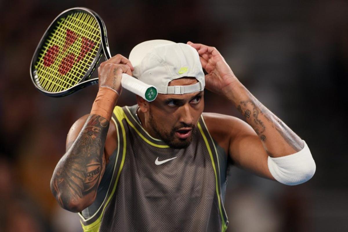 Australia's Nick Kyrgios reacts after a point against Australia's James Duckworth and Aleksandar Vukic during their men's doubles match on day five of the Australian Open tennis tournament in Melbourne on January 16, 2025. Adrian DENNIS / AFP