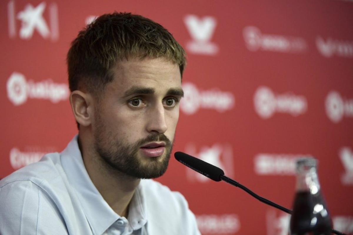 Belgian forward Adnan Januzaj talks to media during his official presentation as FC Sevilla football club's new player at the Ramon Sanchez Pizjuan stadium in Seville on September 7, 2022. CRISTINA QUICLER / AFP
