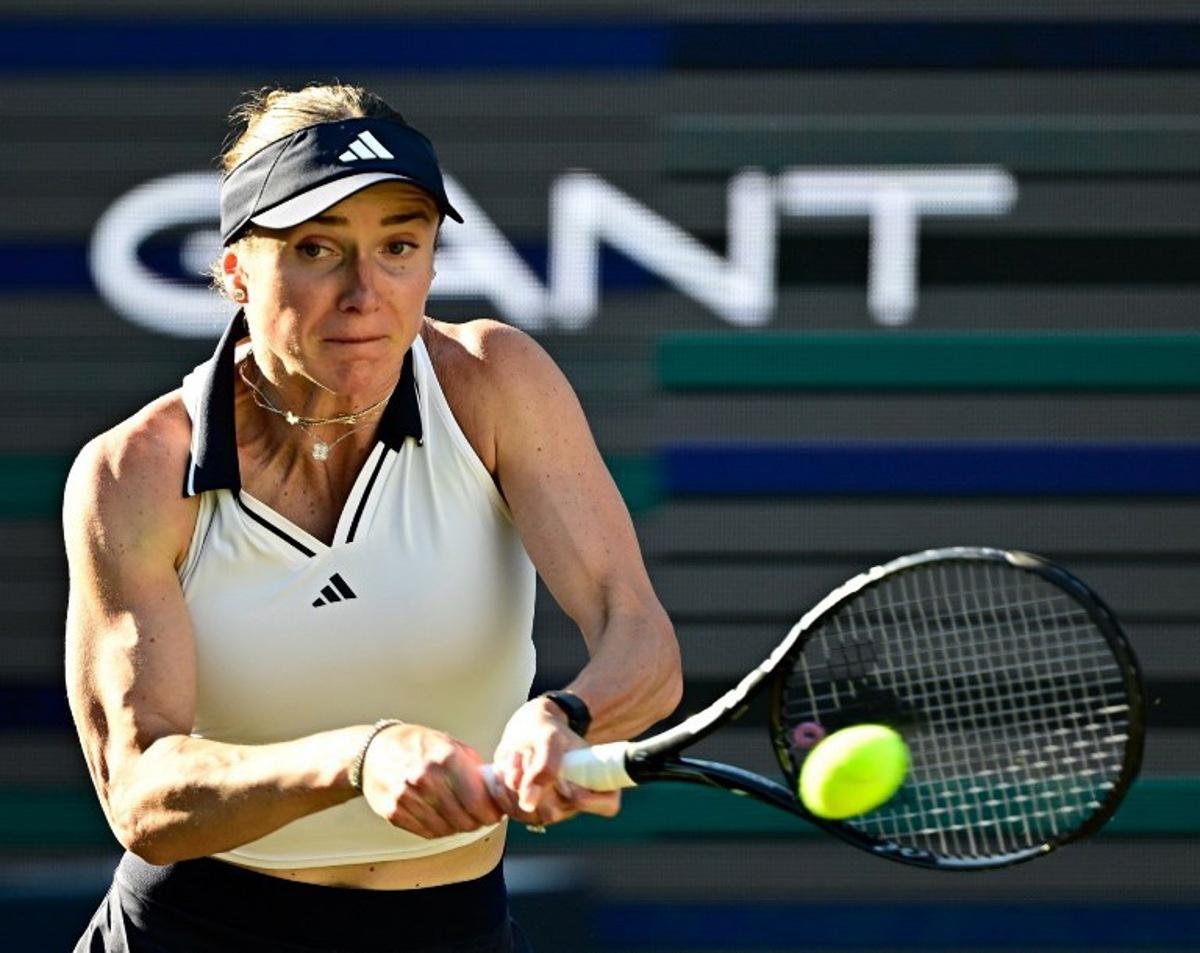 Ukraine's Elina Svitolina returns the ball to the Philippines' Alexandra Eala during the women's singles quarter-final match at the WTA500 Berlin Tennis Open tournament in Berlin on June 19, 2026. Tobias SCHWARZ / AFP