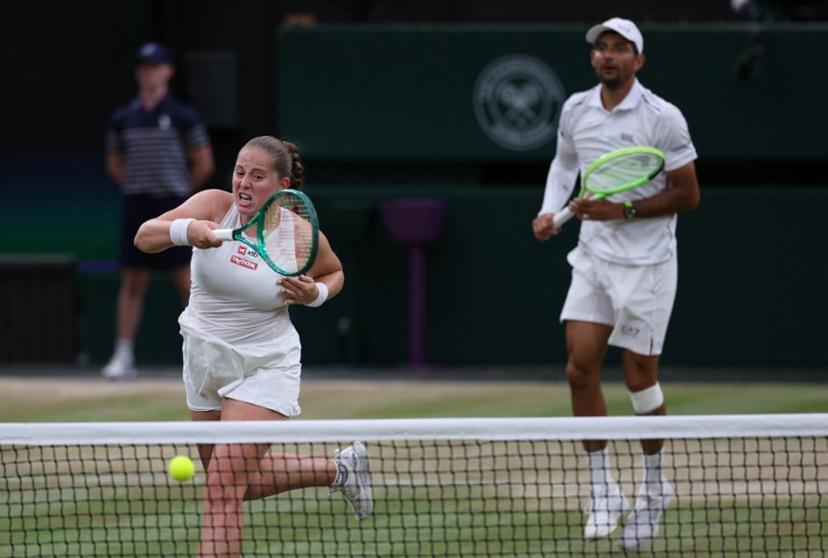 El Salvador's Marcelo Arevalo (R) and Latvia's Jelena Ostapenko play against Australia's players Marc Polmans and Storm Hunter during their mixed's doubles final tennis match on the eleventh day of the 2026 Wimbledon Championships at The All England Lawn Tennis and Croquet Club in Wimbledon, southwest London, on July 9, 2025. Adrian Dennis / AFP