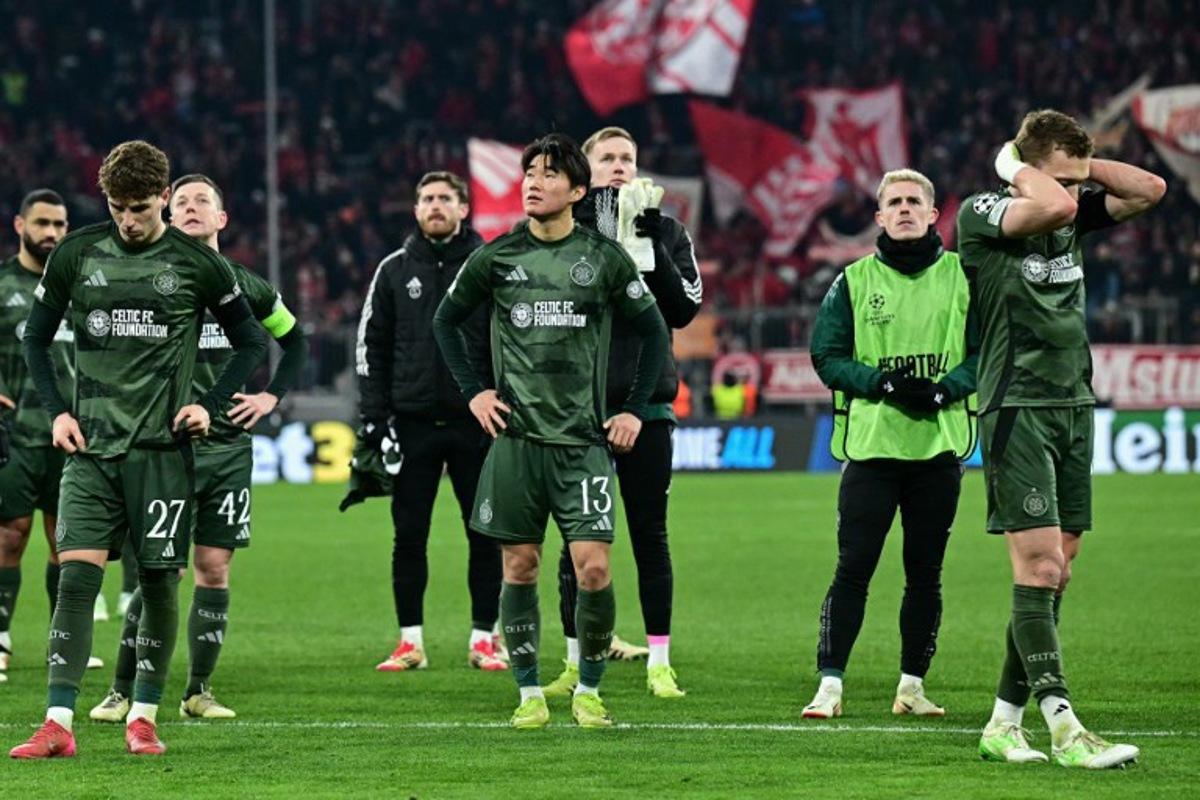 Celtic players reacts after the UEFA Champions League second-leg, knockout phase play-off match FC Bayern Munich vs Celtic on February 18, 2025 in Munich. Tobias SCHWARZ / AFP