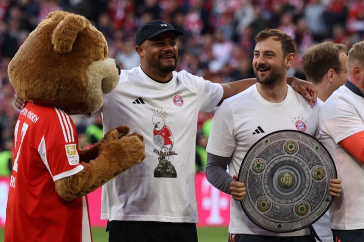 Bayern Munich's Belgian head coach Vincent Kompany celebrates after winning the German first division Bundesliga football match between FC Bayern Munich and VfB Stuttgart in Munich, southern Germany, on April 19, 2026. Harry Kane scored his 32nd goal of the campaign as Bayern Munich cruised to a 4-2 home win over Stuttgart and claim a record-extending 35th Bundesliga title. Alexandra BEIER / AFP