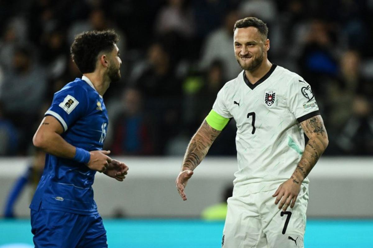 Austria's forward #07 Marko Arnautovic (R) reacts after scoring his team's first goal from the penalty spot during the FIFA World Cup 2026 European qualification football match between Cyprus and Austria at the Alphamega Stadium, on the outskirts of Limassol, on November 15, 2025. Jewel SAMAD / AFP