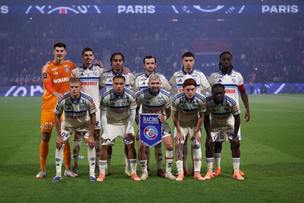 Strasbourg's players pose for a team photograph ahead of the French L1 football match between Paris Saint-Germain (PSG) and RC Strasbourg Alsace at the Parc des Princes Stadium in Paris on October 17, 2025. Franck FIFE / AFP