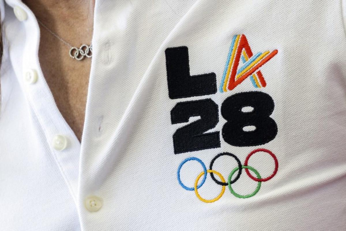 LA28 (Los Angeles 2028) chief athlete officer and former US swimmer Janet Evans speaks with journalists during the event celebrating the arrival of the Olympic flag at Los Angeles International Airport (LAX) in Los Angeles, on August 12, 2024. Los Angeles will host the 2028 Summer Olympic Games. The arrival marks the official Olympic Flag's return to Los Angeles for the first time in 40 years. Etienne LAURENT / AFP