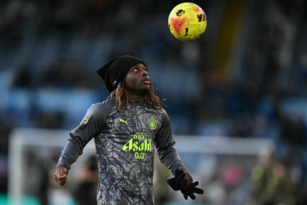 Manchester City's Belgian midfielder #11 Jeremy Doku warms up ahead of the English Premier League football match between Leeds United and Manchester City at Elland Road in Leeds, northern England on February 28, 2026. Oli SCARFF / AFP