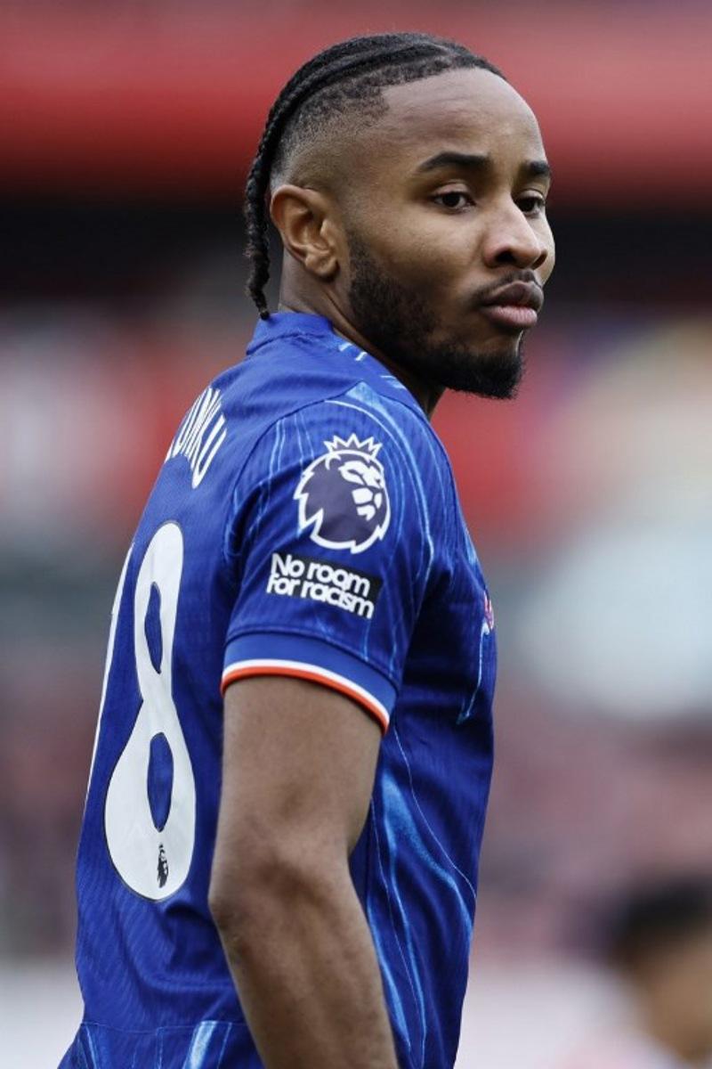 Chelsea's French striker #18 Christopher Nkunku looks on during the English Premier League football match between Arsenal and Chelsea at the Emirates Stadium in London on March 16, 2025. BENJAMIN CREMEL / AFP