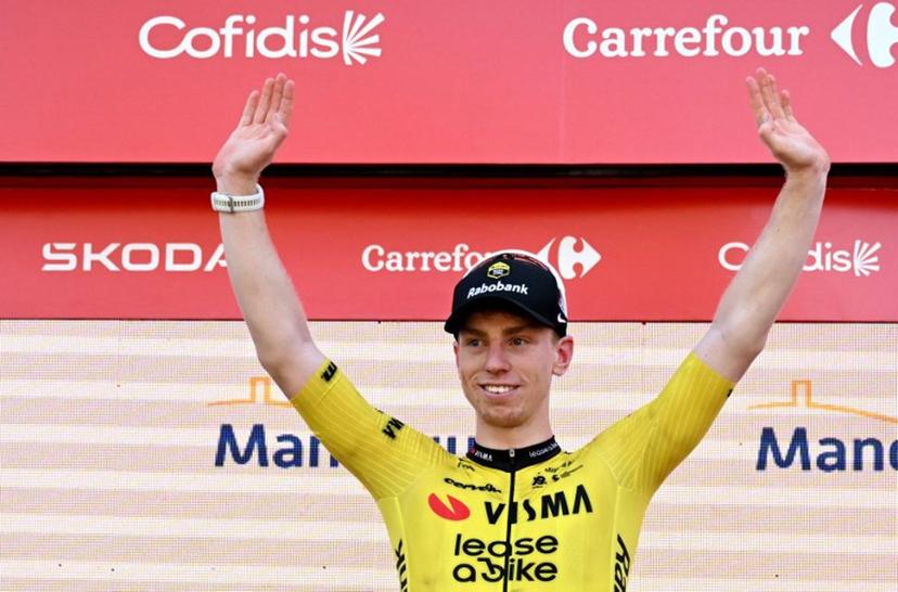 Team Visma-Lease a bike's British rider Matthew Brennan celebrates on the podium after winning the second stage of the Vuelta a Espana 2026, a 214,3 km race between Monaco and Manosque on August 23, 2026. Miguel MEDINA / AFP