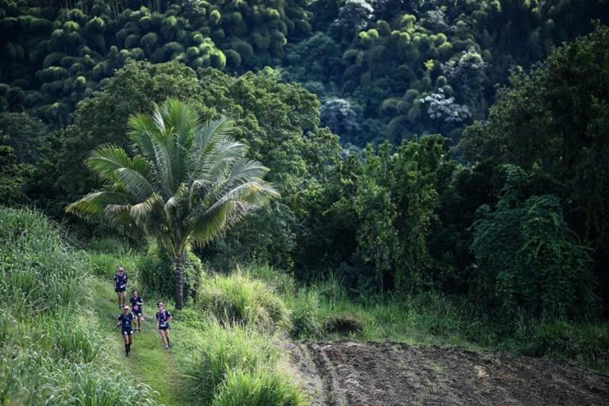 Participants compete in an orienteering race in Saint Pierre as part of the Raid des Alizes exclusively all-female multi sport competition in the French Caribbean island of Martinique on November 27, 2021. Each team represent a charity project of their choice during the competition. According to the final ranking, donations will be directly processed in favor of the represented associations. Anne-Christine POUJOULAT / AFP
