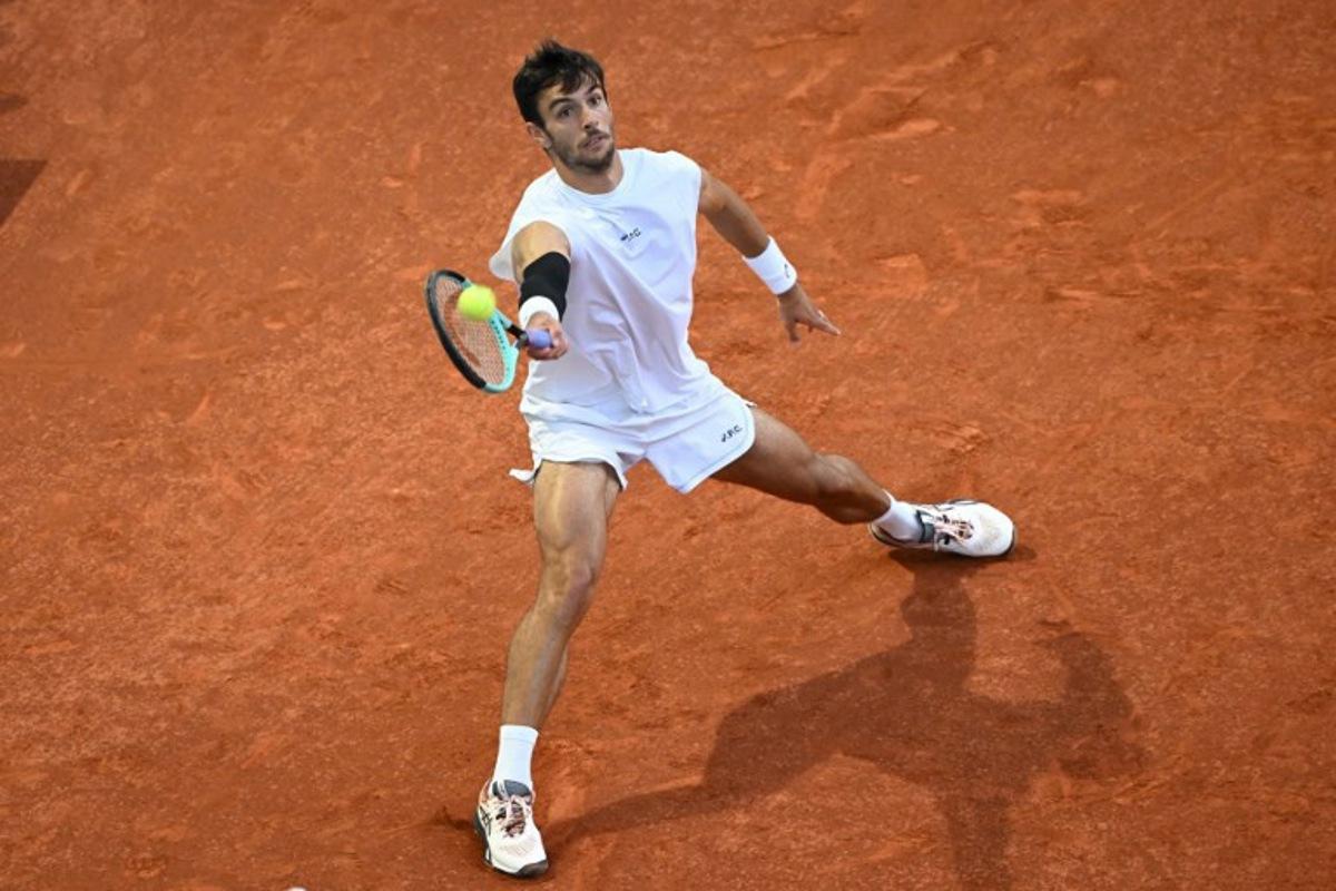 Italy's Lorenzo Musetti returns a forehand to Canada's Gabriel Diallo during their 2025 ATP Tour Madrid Open tennis tournament quarter-final singles match at the Caja Magica in Madrid, on May 1, 2025. JAVIER SORIANO / AFP