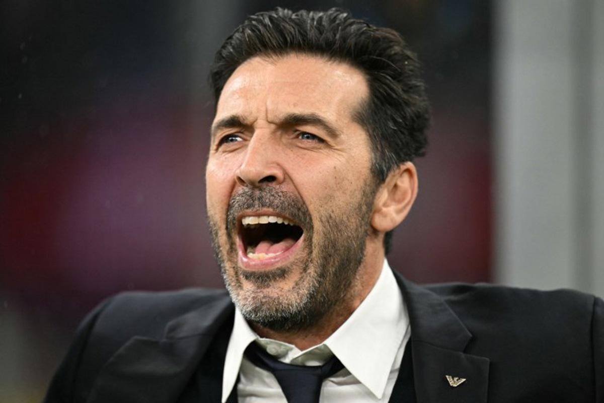 Former goalkeeper Gianluigi Buffon sing the national anthem before the FIFA World Cup 2026 European qualification football match between Italy and Norway, at the San Siro Stadium, in Milan, on November 16, 2025. Stefano RELLANDINI / AFP