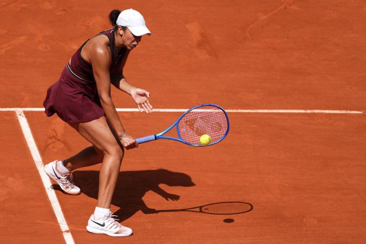 US Madison Keys plays a backhand return to US Hailey Baptiste during their women's singles match on day 9 of the French Open tennis tournament on Court Suzanne-Lenglen at the Roland-Garros Complex in Paris on June 2, 2025. Dimitar DILKOFF / AFP