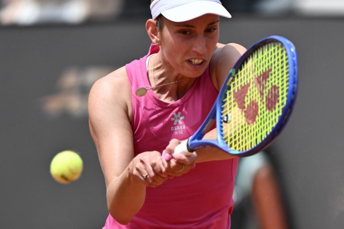 Belgium's Elise Mertens hits a return to Italy's Jasmine Paolini during the WTA Rome Open tennis tournament at Foro Italico in Rome on May 9, 2026. Tiziana FABI / AFP