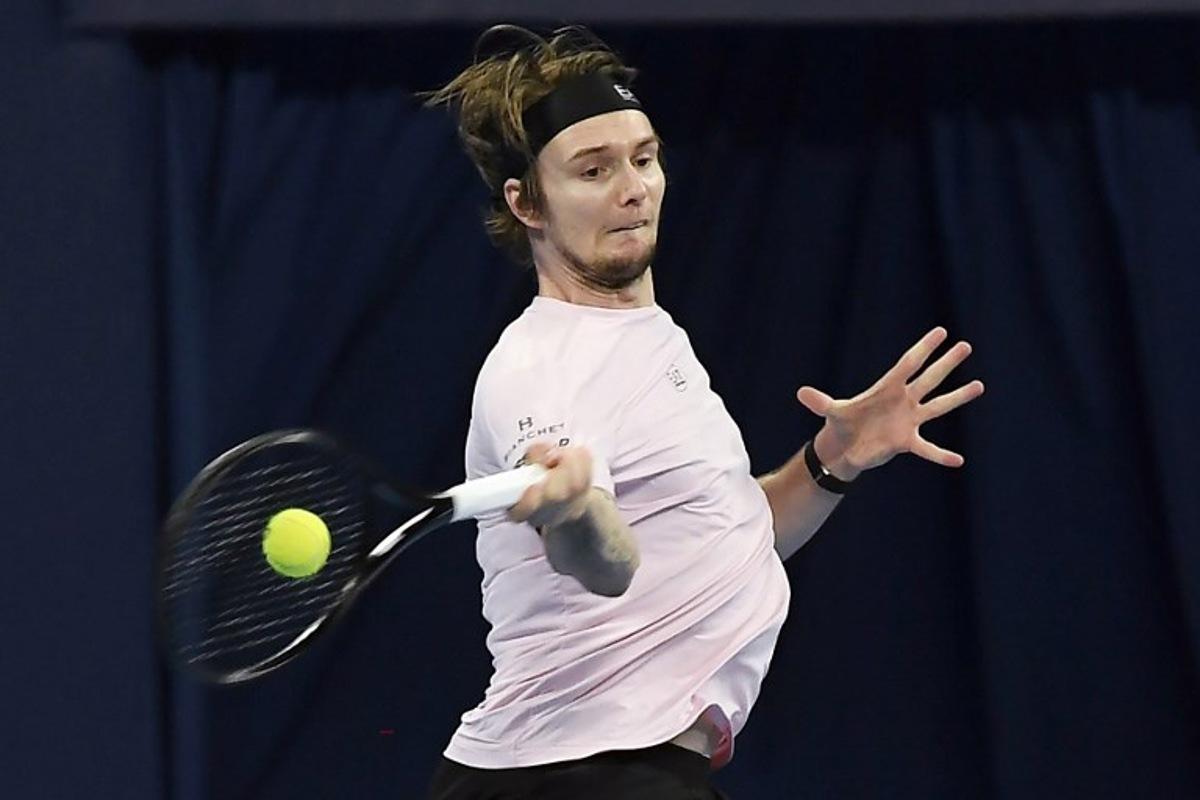 Kazakhstan's Alexander Bublik hits a return to China's Wu Yibing during their men's singles semi-final match at the Hangzhou Open tennis tournament in Hangzhou, in China's eastern Zhejiang province on September 22, 2025. STR / AFP