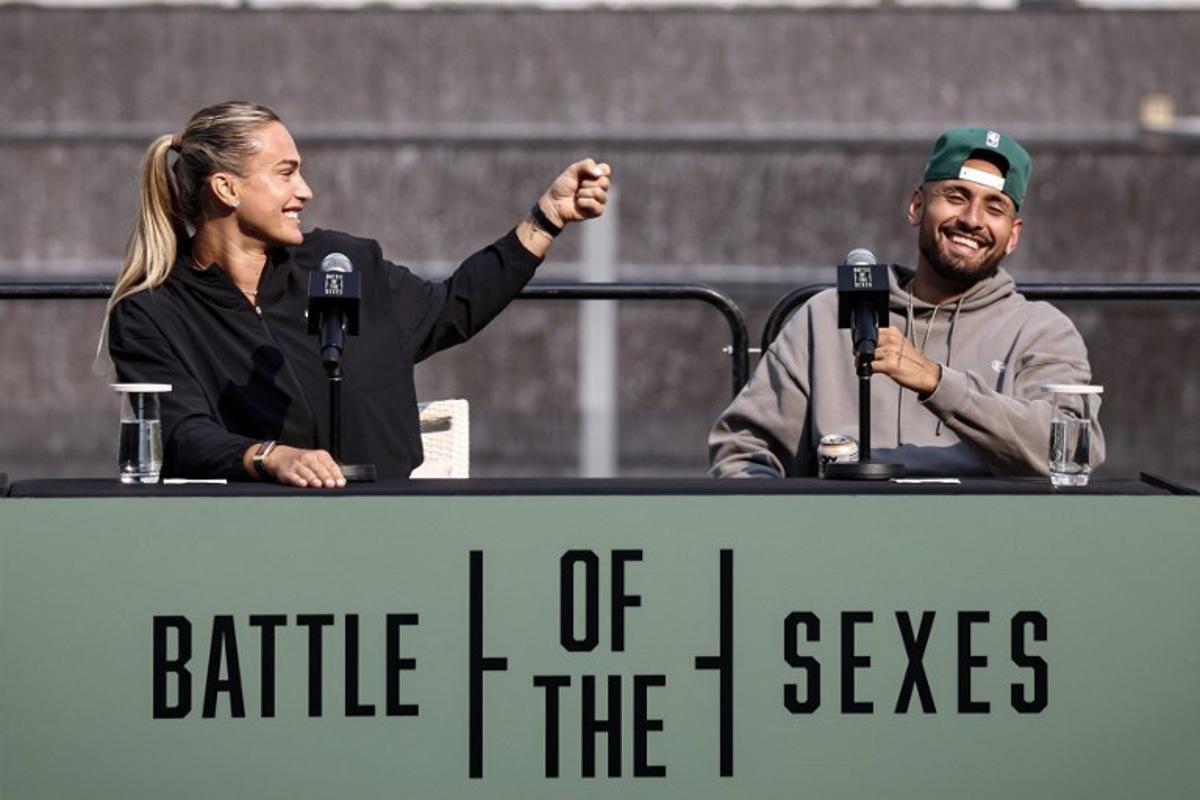 Belarus' Aryna Sabalenka (L) and Australia's Nick Kyrgios react during a press conference on the eve of the Battle of the Sexes exhibition match between Sabalenka and Kyrgios at Atlantis The Royal, in Dubai on December 27, 2025. FADEL SENNA / AFP
