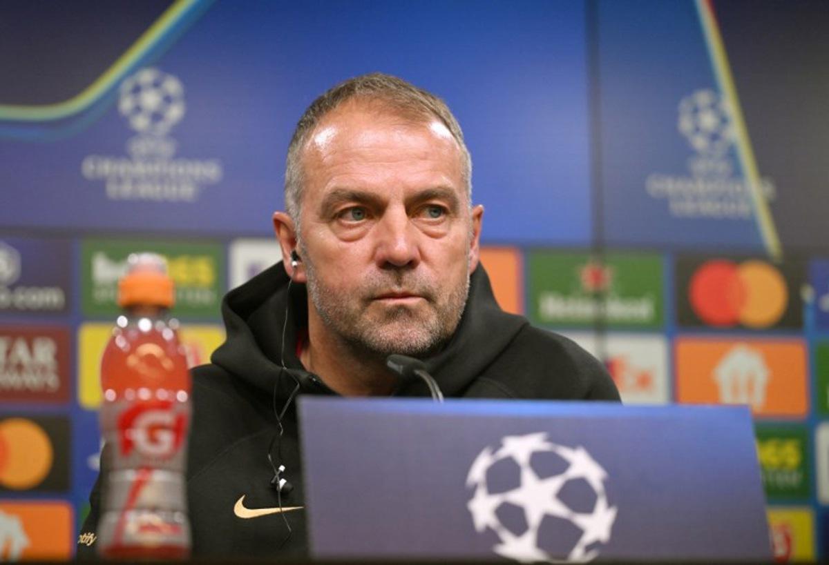 Barcelona's German head coach Hansi Flick addresses a press conference on the eve of the UEFA Champions League quarter-final second-leg football match BVB Borussia Dortmund v FC Barcelona at the Signal Iduna stadium in Dortmund on April 14, 2025. Ina FASSBENDER / AFP