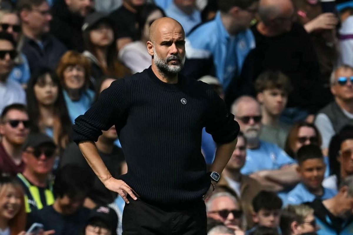 Manchester City's Spanish manager Pep Guardiola looks on during the English Premier League football match between Manchester City and Crystal Palace at the Etihad Stadium in Manchester, north west England, on April 12, 2025. Paul ELLIS / AFP