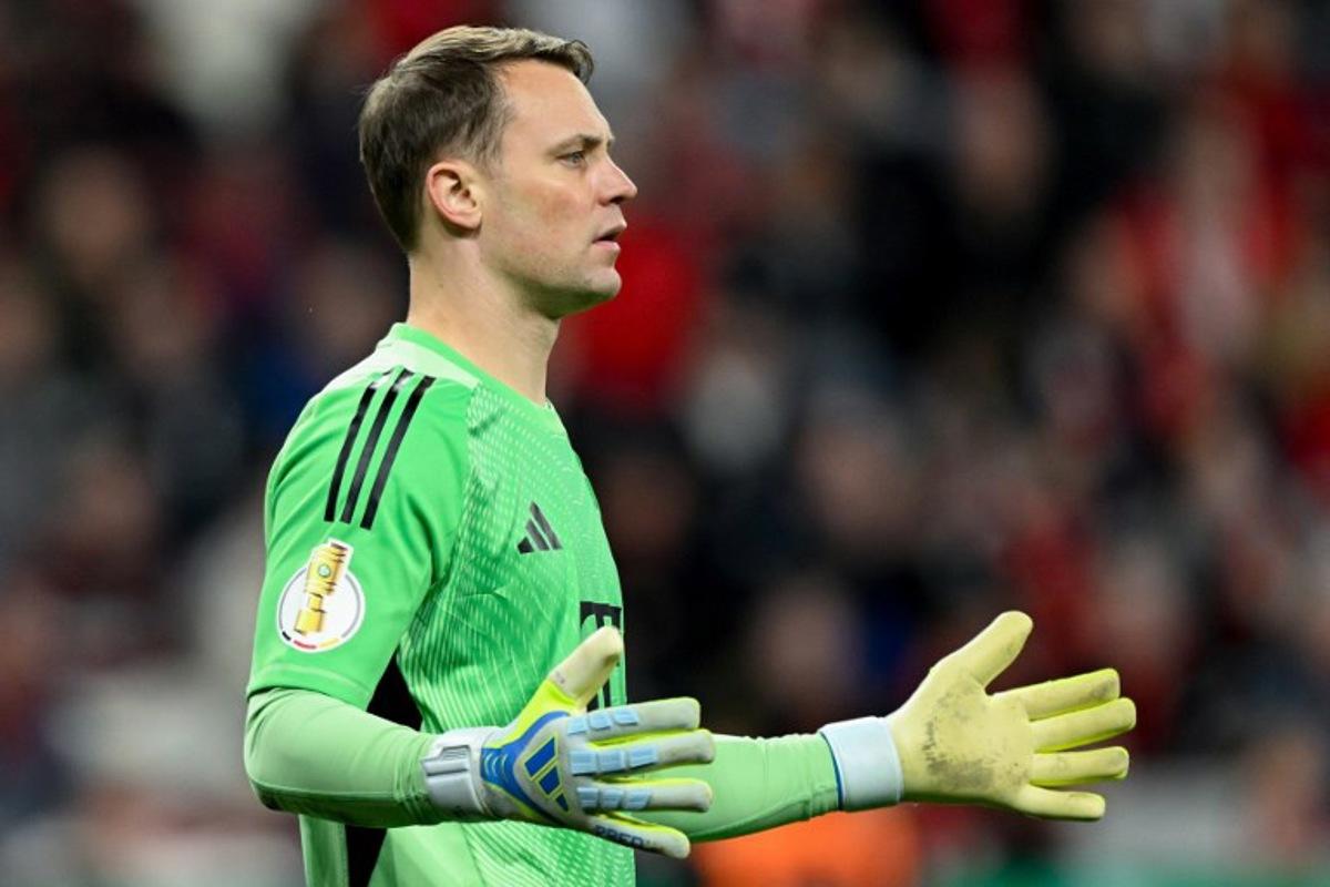 Bayern Munich's German goalkeeper #01 Manuel Neuer reacts during the German Cup (DFB-Pokal) semi-final football match between Bayer 04 Leverkusen and FC Bayern Munich in Leverkusen, western Germany on April 22, 2026. INA FASSBENDER / AFP