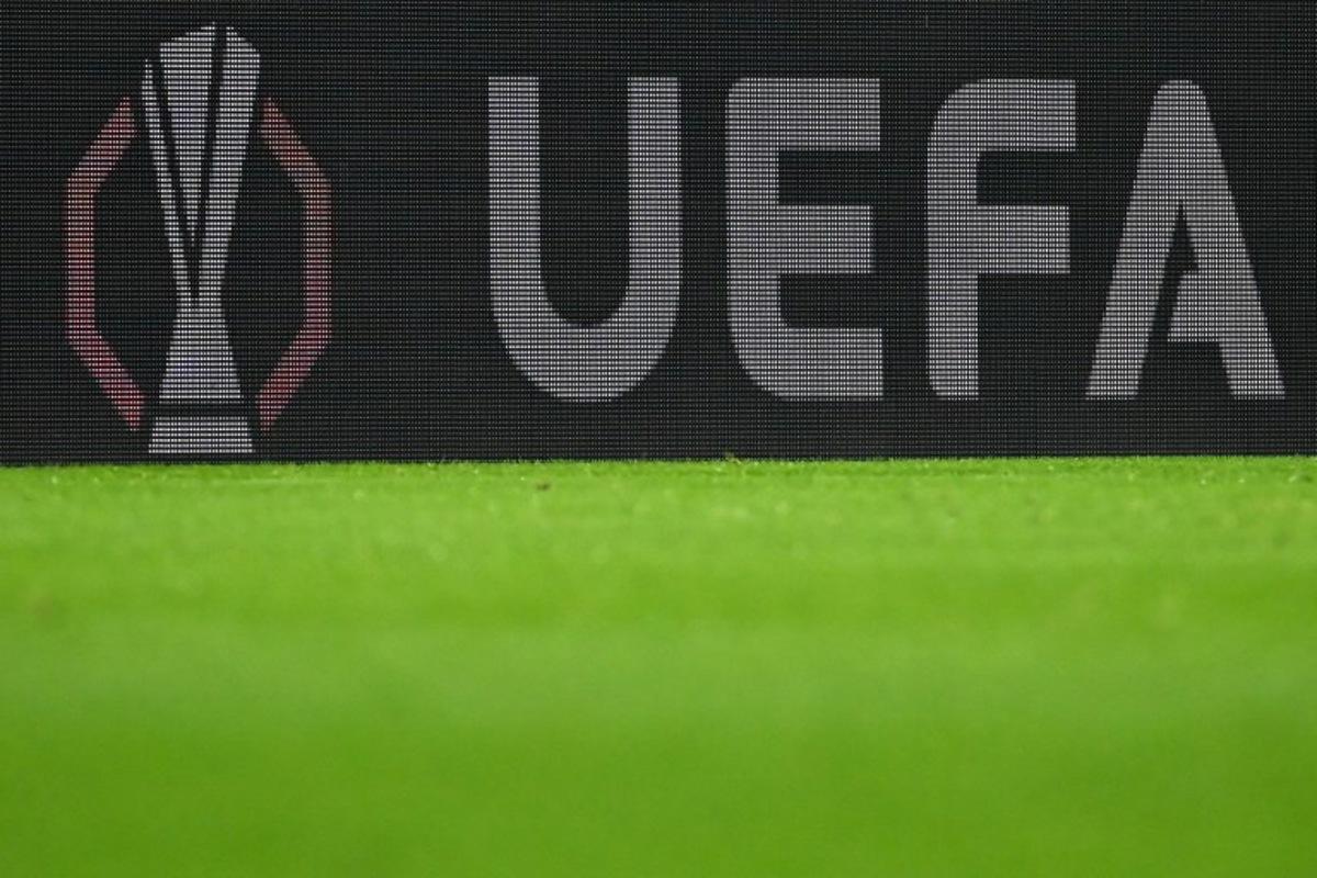 The European Cup logo and the UEFA lettering are visible on an LED wall during the UEFA Europa League first round - day 1 football match between SC Freiburg and FC Basel in Freiburg, southwestern Germany on September 24, 2025. Silas STEIN / AFP