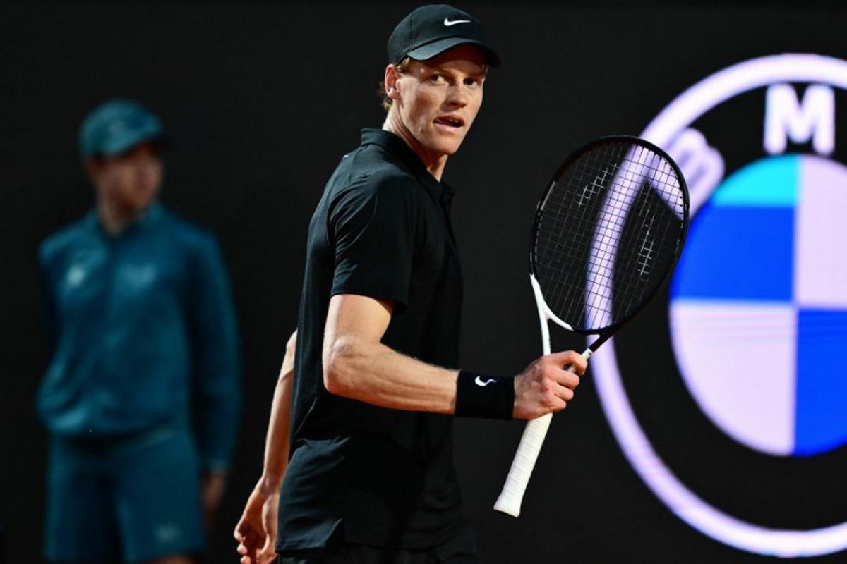 Italy's Jannik Sinner reacts after a point to Argentina's Mariano Navone during their men's singles match of the ATP Rome Open tennis tournament at Foro Italico in Rome on May 10, 2025. Marco BERTORELLO / AFP