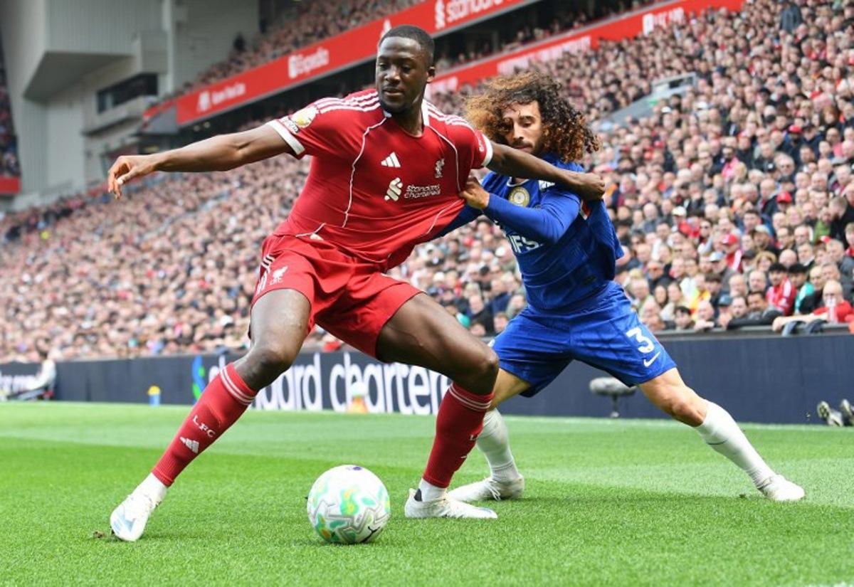 Chelsea's Spanish defender #03 Marc Cucurella (R) pulls on the shirt of Liverpool's French defender #05 Ibrahima Konate during the English Premier League football match between Liverpool and Chelsea at Anfield in Liverpool, north west England on May 9, 2026. PETER POWELL / AFP