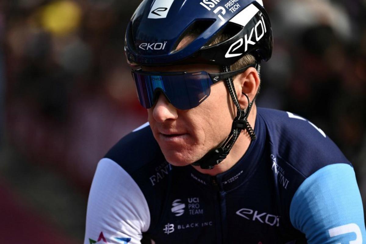 Israel-Premier Tech team's Australian rider Simon Clarke prepares before the 19th one-day classic 'Strade Bianche' (White Roads) cycling race between Siena and Siena, Tuscany, on March 8, 2025. Marco BERTORELLO / AFP