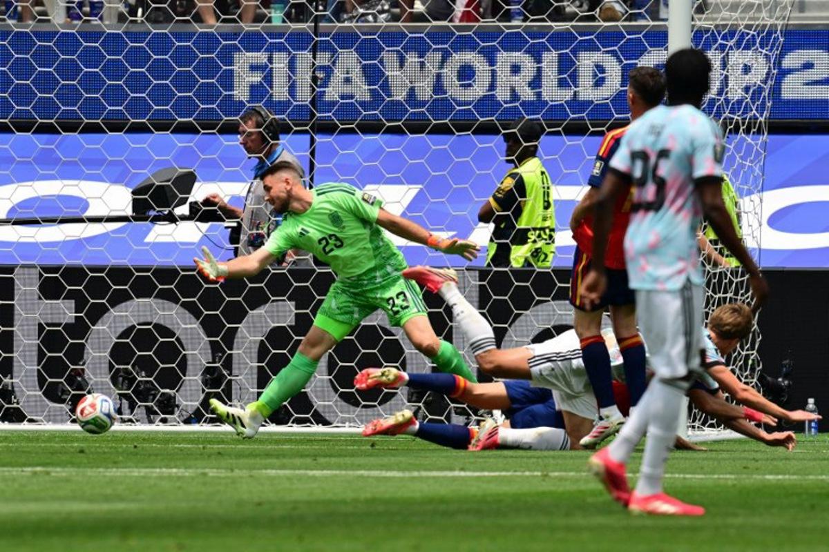 Belgium's forward #17 Charles De Ketelaere (R) scores his team's first goal during the 2026 World Cup football tournament quarter-final match between Spain and Belgium at the Los Angeles Stadium in Inglewood on July 10, 2026. Frederic J. Brown / AFP