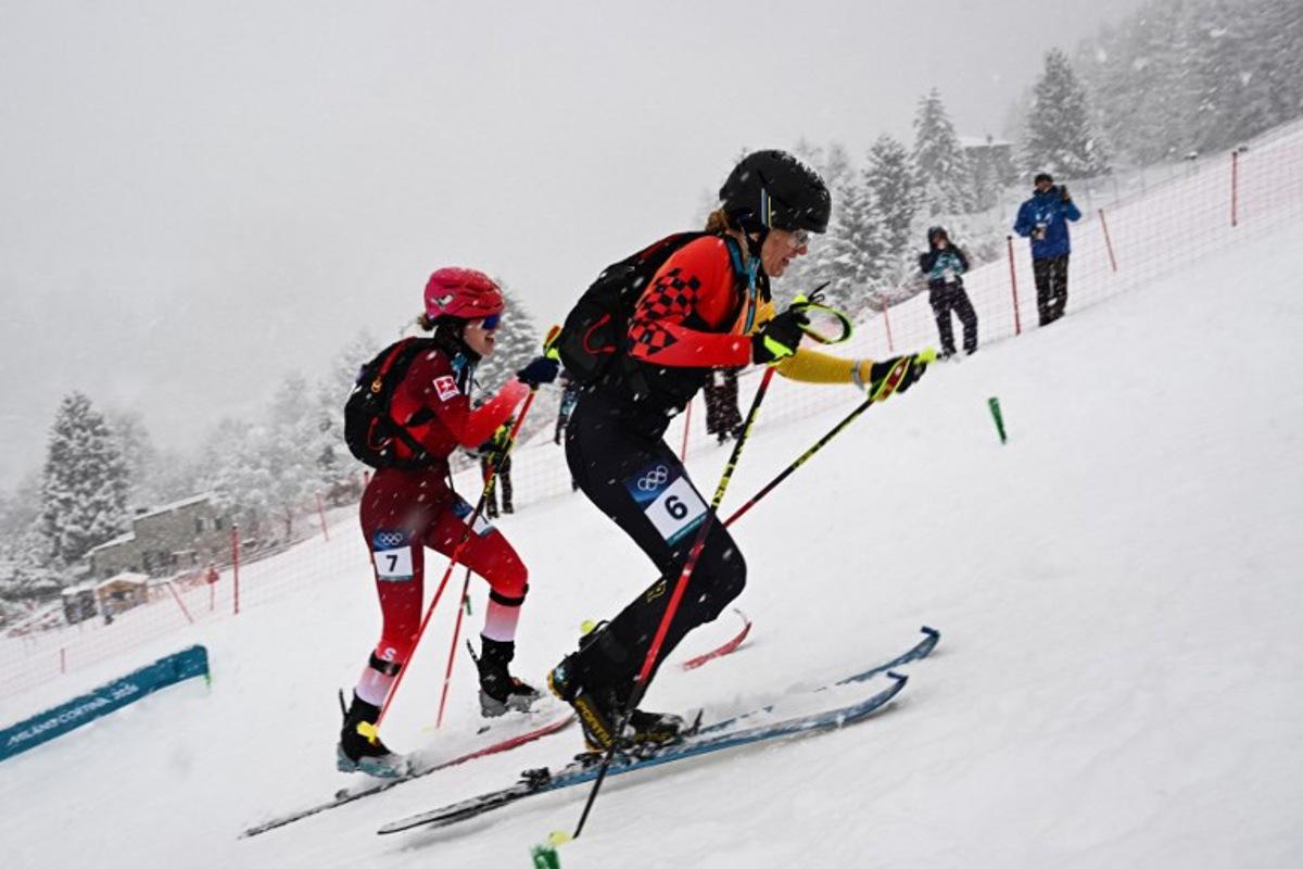 Switzerland's Caroline Ulrich (L) and Germany's Tatjana Paller compete in the women's sprint ski mountaineering semi-final 1 heat 2 during the Milano Cortina 2026 Winter Olympic Games at the Stelvio Ski Centre in Bormio (Valtellina) on February 19, 2026. Fabrice COFFRINI / AFP