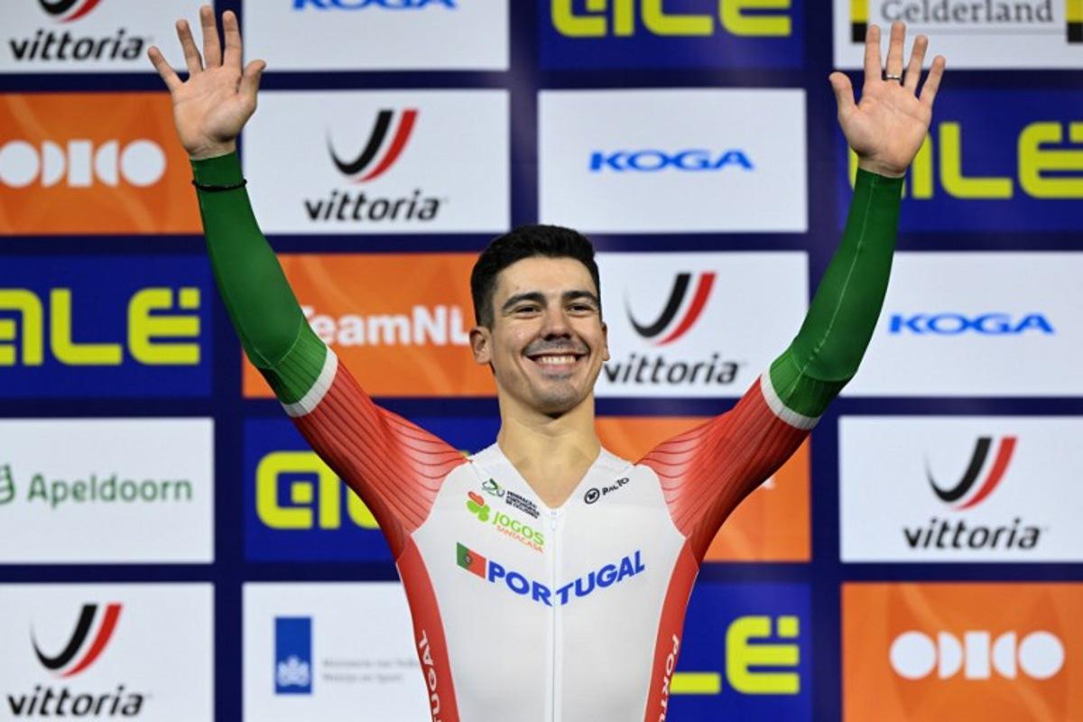 First placed Portugal's Iuri Leitao celebrates on the podium for the Men's Scratch race during the third day of the UEC European Track Cycling Championships at the Omnisport indoor arena in Apeldoorn, on January 12, 2024. JOHN THYS / AFP