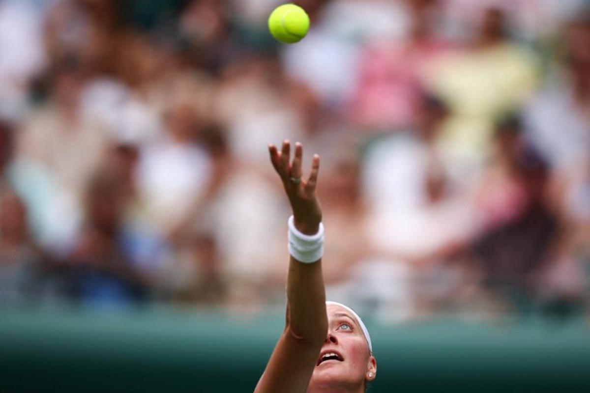 Czech Republic's Petra Kvitova serves the ball to US player Emma Navarro during their women's singles first round tennis match on the second day of the 2025 Wimbledon Championships at The All England Lawn Tennis and Croquet Club in Wimbledon, southwest London, on July 1, 2025. HENRY NICHOLLS / AFP