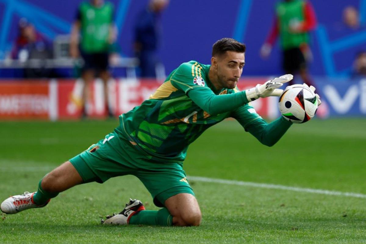 Belgium's goalkeeper #01 Koen Casteels catches the ball during the UEFA Euro 2024 round of 16 football match between France and Belgium at the Duesseldorf Arena in Duesseldorf on July 1, 2024. KENZO TRIBOUILLARD / AFP