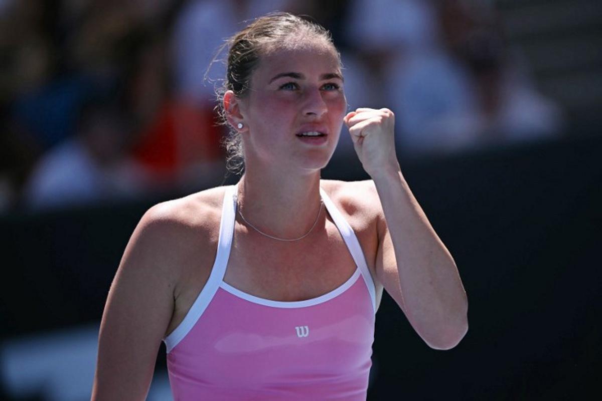 Ukraine's Marta Kostyuk reacts after a point against France's Elsa Jacquemot during their women's singles match on day one of the Australian Open tennis tournament in Melbourne on January 18, 2026. WILLIAM WEST / AFP