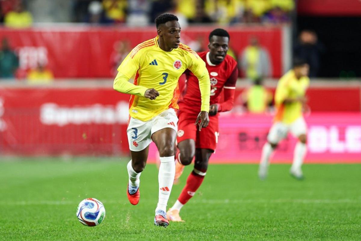 Colombia's defender #03 Jhon Lucumi controls the ball during the international friendly football match between Canada and Colombia at Sports Illustrated Stadium in Harrison, New Jersey, on October 14, 2025. CHARLY TRIBALLEAU / AFP