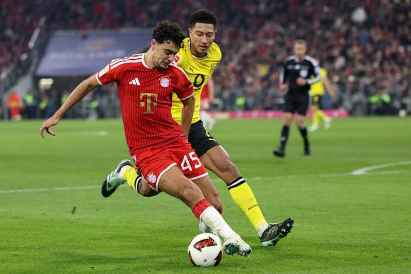 Bayern Munich's German midfielder #45 Aleksandar Pavlovic and Dortmund's English midfielder #07 Jobe Bellingham vie for the ball during the German first division Bundesliga football match between FC Bayern Munich and BVB Borussia Dortmund in Munich, southern Germany, on October 31, 2026. Alexandra BEIER / AFP