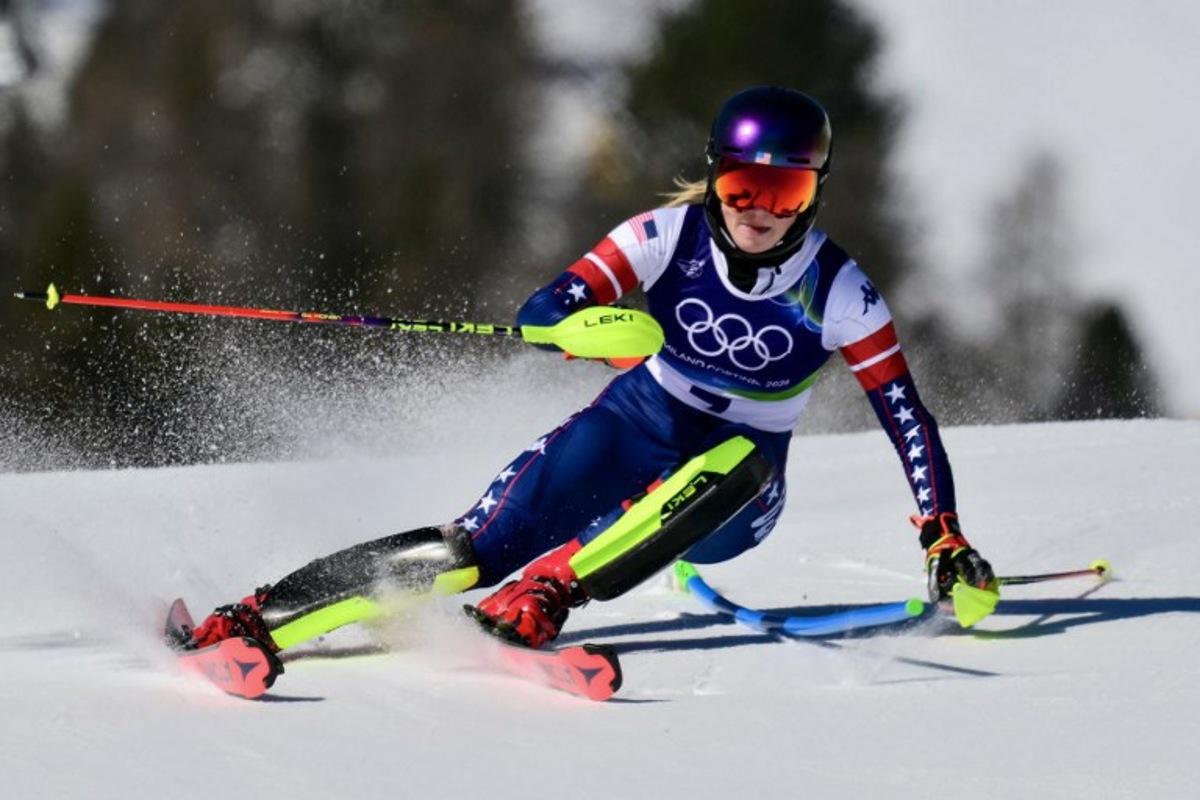 USA's Mikaela Shiffrin competes in the first run of the women's slalom event during the Milano Cortina 2026 Winter Olympic Games at the Tofane Alpine Skiing Centre in Cortina d'Ampezzo on February 18, 2026. Stefano RELLANDINI / AFP