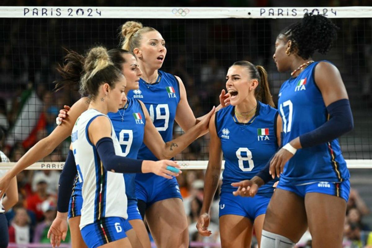 Italy's #19 Sarah Luisa Fahr, Italy's #08 Alessia Orro and Italy's #17 Myriam Fatime Sylla celebrate after a point in the women's volleyball gold medal match between USA and Italy at the South Paris Arena 1 in Paris during the Paris 2024 Olympic Games on August 11, 2024. Natalia KOLESNIKOVA / AFP